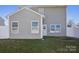 Two-story home shows a fenced backyard with green grass at 616 Smokehouse Ln, Albemarle, NC 28001