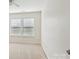 Light-filled bedroom featuring neutral carpet, two windows, and white walls for a modern look at 616 Smokehouse Ln, Albemarle, NC 28001