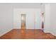 Bedroom with hardwood flooring, white walls, and two doorways at 616 Smokehouse Ln, Albemarle, NC 28001