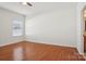 Bedroom featuring a ceiling fan, wood floors, and one window at 616 Smokehouse Ln, Albemarle, NC 28001