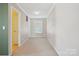 Bright bedroom with neutral carpet, white trim, and a window providing natural light at 616 Smokehouse Ln, Albemarle, NC 28001