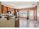 Eat-in kitchen featuring tile flooring, stainless steel appliances, and granite countertops with bar seating at 616 Smokehouse Ln, Albemarle, NC 28001