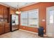 Bright eat-in kitchen with tile floors, stainless steel appliances, and a view to the back yard at 616 Smokehouse Ln, Albemarle, NC 28001