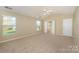 Neutral bedroom with ensuite bathroom and large windows at 6720 Neuhoff Ln, Charlotte, NC 28269