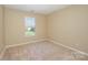 Neutral bedroom with window at 6720 Neuhoff Ln, Charlotte, NC 28269