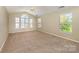 Large carpeted bedroom with vaulted ceilings and lots of natural light at 6720 Neuhoff Ln, Charlotte, NC 28269