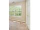 Bedroom features natural light, neutral carpet, and a white door with gold hardware at 6720 Neuhoff Ln, Charlotte, NC 28269