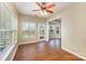 Eat-in kitchen area with tiled floor, ceiling fan, and access to deck with fenced-in backyard at 6720 Neuhoff Ln, Charlotte, NC 28269