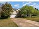 Lovely two-story home featuring a spacious driveway, attached garage and a covered porch at 6720 Neuhoff Ln, Charlotte, NC 28269