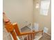 View of a staircase with wooden handrails, light-colored walls, and a window allowing natural light at 6720 Neuhoff Ln, Charlotte, NC 28269