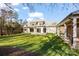 Expansive backyard view showcasing the home's architecture and outdoor living space at 810 Martingale Ln, Davidson, NC 28036