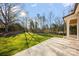 Spacious backyard featuring a stone patio perfect for outdoor entertainment at 810 Martingale Ln, Davidson, NC 28036