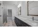 Spacious bathroom featuring double vanities, marble countertops, and a glass-enclosed shower at 810 Martingale Ln, Davidson, NC 28036