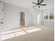 Bedroom with carpet, a ceiling fan, and a window offering views of the surrounding landscape at 810 Martingale Ln, Davidson, NC 28036