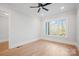 Light filled bedroom featuring hardwood floors and a modern ceiling fan at 810 Martingale Ln, Davidson, NC 28036