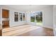 Bright dining room features hardwood floors, large windows, and sliding glass doors to the outdoor patio at 810 Martingale Ln, Davidson, NC 28036