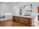 Kitchen with marble counters, wood island and stainless appliances at 810 Martingale Ln, Davidson, NC 28036