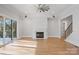 Open concept living room with fireplace and sliding glass doors at 810 Martingale Ln, Davidson, NC 28036