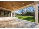 Covered patio with a ceiling fan and travertine flooring with an outdoor space view at 810 Martingale Ln, Davidson, NC 28036