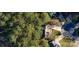 Aerial view of a home nestled among lush trees, situated on a cul-de-sac with well-maintained landscaping at 9131 Strattonville Ct, Huntersville, NC 28078