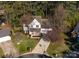 Aerial view of a two-story home surrounded by mature trees and a well-maintained lawn in a cul-de-sac at 9131 Strattonville Ct, Huntersville, NC 28078