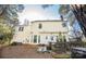 Exterior view of a two-story home with a spacious deck and landscaped backyard at 9131 Strattonville Ct, Huntersville, NC 28078