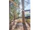 Enjoy this backyard with a tree swing and a view of the home, hot tub, and deck, perfect for outdoor relaxation at 9131 Strattonville Ct, Huntersville, NC 28078