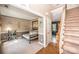 Inviting entryway featuring beautiful stairway, hardwood floors, and view into the Lake Norman-themed living room at 9131 Strattonville Ct, Huntersville, NC 28078