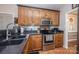 A bright kitchen features stainless appliances, custom cabinets, and contrasting countertops at 9131 Strattonville Ct, Huntersville, NC 28078