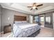 This main bedroom includes tray ceilings, recessed lighting, and a sliding barn door at 9131 Strattonville Ct, Huntersville, NC 28078