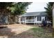 View of the home's rear, including a small covered porch, from the spacious backyard at 103 Pine Meadows Cir, Hickory, NC 28601