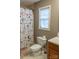 Functional bathroom with a window letting in light and a decorative shower curtain at 103 Pine Meadows Cir, Hickory, NC 28601