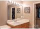 Bathroom featuring vanity with framed mirror, lighting, and closet at 103 Pine Meadows Cir, Hickory, NC 28601