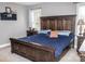 Spacious bedroom featuring a large, dark wood bed frame and matching nightstands at 103 Pine Meadows Cir, Hickory, NC 28601