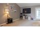 Cozy living room featuring carpet floors, warm neutral paint, with beach-themed decor at 103 Pine Meadows Cir, Hickory, NC 28601