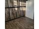 Bedroom with wood paneling, wood floors and white cabinet at 1033 College Ave, Shelby, NC 28152