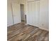 This bedroom boasts wood flooring and a closet with bi-fold doors at 1033 College Ave, Shelby, NC 28152