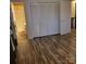 Bedroom with wood flooring adjacent to a bathroom at 1033 College Ave, Shelby, NC 28152