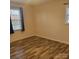 Neutral bedroom with modern vinyl floor, natural light, and blinds at 1033 College Ave, Shelby, NC 28152