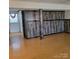 Spacious living room with wood look paneling and hardwood floors at 1033 College Ave, Shelby, NC 28152