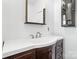 Bathroom featuring a vanity with white countertop and dark wood finish and a large mirror at 1111 W 4Th Ave, Gastonia, NC 28052