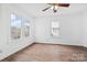 Well-lit bedroom featuring hardwood floors and bright lighting at 1111 W 4Th Ave, Gastonia, NC 28052