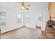 Bright kitchen area featuring wood-look floors, white walls, and ample natural light from the surrounding windows at 1111 W 4Th Ave, Gastonia, NC 28052