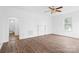 Bright living room with neutral walls, decorative ceiling fan and modern flooring at 1111 W 4Th Ave, Gastonia, NC 28052