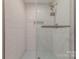 Modern bathroom featuring a glass enclosed shower with white tile and updated fixtures at 1114 University Dr, Lancaster, SC 29720