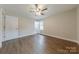 Spacious bedroom with natural light, ceiling fan, and luxury vinyl floors at 1114 University Dr, Lancaster, SC 29720