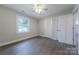 A cozy bedroom features a ceiling fan, hardwood floors, and a closet at 1114 University Dr, Lancaster, SC 29720