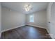 A brightly lit bedroom with ceiling fan and hardwood flooring at 1114 University Dr, Lancaster, SC 29720