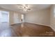 A large living room featuring a ceiling fan and hardwood flooring at 1114 University Dr, Lancaster, SC 29720