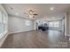 Open concept living room with kitchen and many large windows at 1114 University Dr, Lancaster, SC 29720